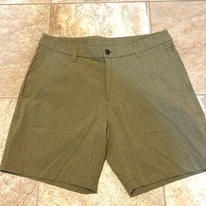 Men’s olive green Lululemon shorts.